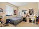 Comfortable bedroom with neutral walls, window and a cozy bed at 26143 E Fremont Pl, Aurora, CO 80016