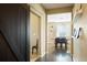 Hallway with sliding barn door and dining area in view at 26143 E Fremont Pl, Aurora, CO 80016