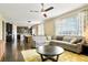 Spacious living room with open layout, fan, and great natural light at 26143 E Fremont Pl, Aurora, CO 80016