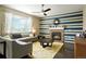 Comfortable living room features a fireplace, large windows, and stylish decor at 26143 E Fremont Pl, Aurora, CO 80016