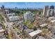 Aerial view of the neighborhood with a view of the Denver skyline and a golf course in the background at 1349 Race St # 5, Denver, CO 80206