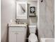 Charming bathroom with granite countertop vanity, tile shower, and neutral paint at 1349 Race St # 5, Denver, CO 80206