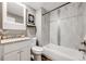 Bathroom with neutral paint, granite countertop vanity, and tile shower at 1349 Race St # 5, Denver, CO 80206