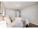 Bedroom features neutral paint, hard wood floors and natural light from a window at 1349 Race St # 5, Denver, CO 80206