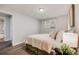 Spacious bedroom features wood floors, an adjacent bathroom, and lots of light at 1349 Race St # 5, Denver, CO 80206