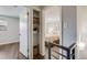 Hallway with closet and bedroom view featuring hard wood floors and neutral paint at 1349 Race St # 5, Denver, CO 80206