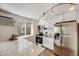 Bright kitchen with stainless steel appliances, granite counters, and a window offering natural light at 1349 Race St # 5, Denver, CO 80206