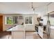 Bright kitchen featuring stainless steel appliances, granite countertops and a breakfast bar at 1349 Race St # 5, Denver, CO 80206