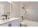 Bathroom with a tub shower, updated vanity, and modern hardware at 2358 Dogwood Cir, Louisville, CO 80027