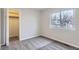 This bedroom features plush carpeting, a closet, and a window for natural light at 2358 Dogwood Cir, Louisville, CO 80027