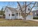 Charming home featuring a two-car garage and appealing stone and blue siding accents at 2358 Dogwood Cir, Louisville, CO 80027