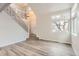 Beautifully designed living room boasting high ceilings, hardwood floors, and stylish staircase at 2358 Dogwood Cir, Louisville, CO 80027