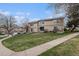 Large backyard with lawn, sidewalk, and convenient access to parking at 1514 S Ouray Cir # B, Aurora, CO 80017
