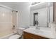 Full bathroom featuring a tub/shower combo, single vanity, and stackable washer and dryer at 1514 S Ouray Cir # B, Aurora, CO 80017
