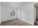 Bedroom with neutral carpet, large window, and ample closet space at 1514 S Ouray Cir # B, Aurora, CO 80017