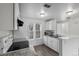 Bright kitchen with white cabinets, granite countertops, and stainless steel appliances at 1514 S Ouray Cir # B, Aurora, CO 80017
