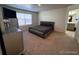 This bedroom offers a dark gray bed frame and plush gray carpeting at 2351 Monte Vista St, Fort Lupton, CO 80621