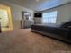 Bright bedroom with a modern dresser, TV, and comfortable bed at 2351 Monte Vista St, Fort Lupton, CO 80621