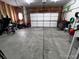 A spacious unfinished garage with a large door, ready for vehicles or storage at 2351 Monte Vista St, Fort Lupton, CO 80621