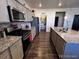 A contemporary kitchen featuring granite countertops and stainless steel appliances at 2351 Monte Vista St, Fort Lupton, CO 80621