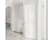 Open attic doorway showing stairs, adjacent rooms, and fresh white paint at 3901 Alcott St, Denver, CO 80211