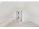 Attic space ready for customization with freshly painted white finish and doorways at 3901 Alcott St, Denver, CO 80211