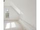 An attic featuring windows offering natural light, and fresh white paint at 3901 Alcott St, Denver, CO 80211