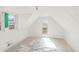 Bright attic room features natural light from windows and white painted finishes at 3901 Alcott St, Denver, CO 80211