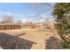 Expansive backyard with potential for landscaping and outdoor activities; features a fence and detached garage at 3901 Alcott St, Denver, CO 80211