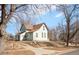 Two story home with driveway and a well-maintained lawn at 3901 Alcott St, Denver, CO 80211