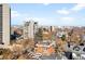 Aerial view features the rooftops of homes and buildings with mountain backdrop in the distance at 1313 N Williams St # 301, Denver, CO 80218