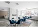 Inviting dining area with modern fireplace and large windows overlooking the outdoors at 1313 N Williams St # 301, Denver, CO 80218