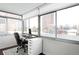 Bright home office featuring a modern work setup and expansive views from large windows at 1313 N Williams St # 301, Denver, CO 80218