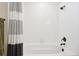 Modern bathroom features a soaking tub with white tile and shower head at 16860 Askins Loop # 102, Parker, CO 80134