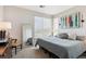Bright bedroom with large window and decor accents at 16860 Askins Loop # 102, Parker, CO 80134