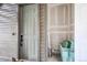 A light gray front door with security features and the number 102 is visible at 16860 Askins Loop # 102, Parker, CO 80134