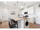Charming kitchen with a granite-topped island and stainless steel appliances at 16860 Askins Loop # 102, Parker, CO 80134