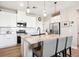 Bright kitchen with white cabinetry, granite countertops, and stainless appliances at 16860 Askins Loop # 102, Parker, CO 80134