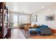 Stylish living room featuring wood floors and lots of natural light at 16860 Askins Loop # 102, Parker, CO 80134