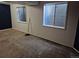 Unfinished basement with large window and neutral wall colors at 16094 E Exposition Dr, Aurora, CO 80017