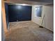 Unfinished basement featuring a single, rectangular window and painted accent wall at 16094 E Exposition Dr, Aurora, CO 80017