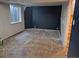 Spacious unfinished basement with painted accent wall and window at 16094 E Exposition Dr, Aurora, CO 80017