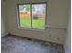Bedroom featuring vinyl flooring, bright windows and a view to the yard at 16094 E Exposition Dr, Aurora, CO 80017