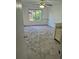 View of bedroom with luxury vinyl flooring and bright window at 16094 E Exposition Dr, Aurora, CO 80017