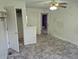 Bedroom features vinyl flooring and an entryway to another room at 16094 E Exposition Dr, Aurora, CO 80017