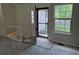 Inviting foyer with staircase and tiled entrance, open to a bright living space at 16094 E Exposition Dr, Aurora, CO 80017