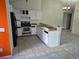 Kitchen area featuring white cabinetry and black appliances at 16094 E Exposition Dr, Aurora, CO 80017