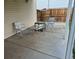 Outdoor patio featuring seating area with a table and four chairs at 16094 E Exposition Dr, Aurora, CO 80017