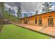 Backyard of a modern home with a deck and a well-maintained lawn area at 15175 Rainbow Dr, Sedalia, CO 80135