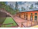 A modern home with a large wooden deck and artificial turf backyard at 15175 Rainbow Dr, Sedalia, CO 80135